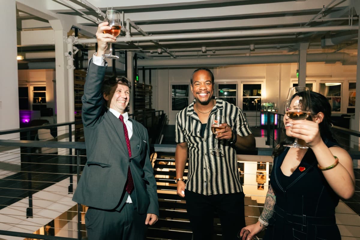 A toast on the mezzanine overlooking the salon floor